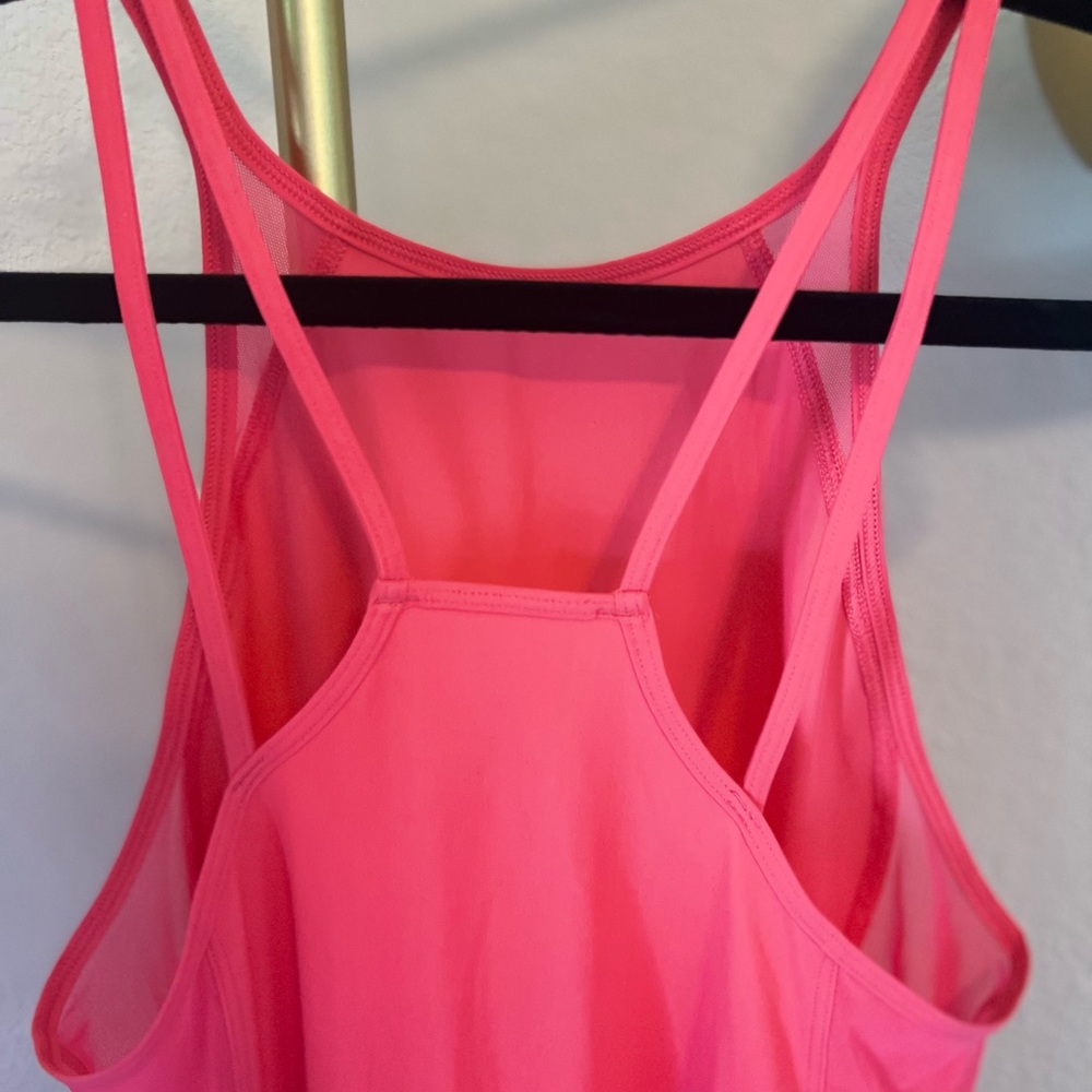Lululemon workout top size 4.  Pink/salmon color - Picture 3 of 6